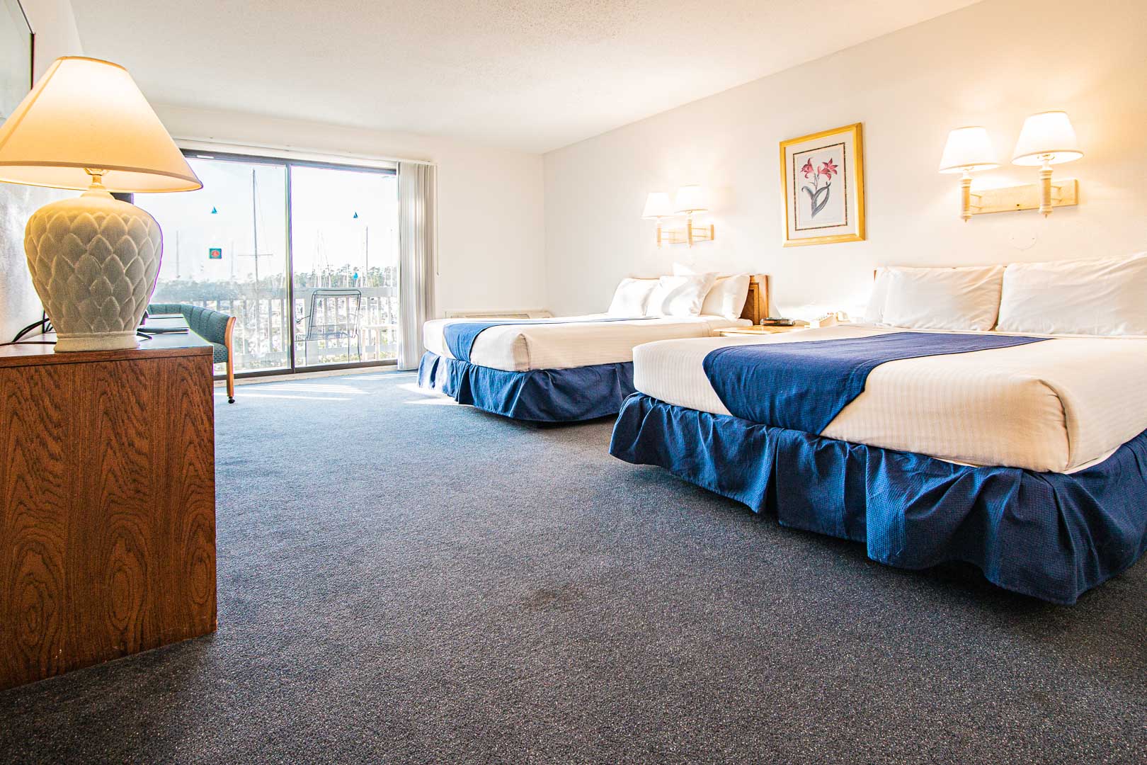 A spacious bedroom with double beds at VRI's Harbourside II in New Bern, North Carolina.
